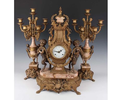 A late 20th century gilt metal and marble mantel clock garniture, the clock with eight day movement striking on two bells, th
