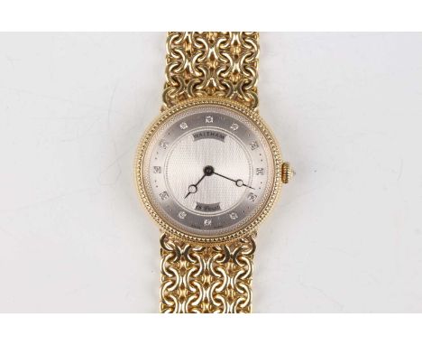 A Waltham 18ct gold circular cased gentleman's bracelet wristwatch with signed and jewelled gilt movement, the engine turned 