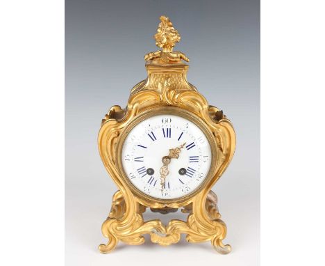 A late 19th century French ormolu cased mantel clock, the eight day movement striking hours and half hours on a bell, the bac