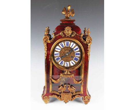 A late 19th century French metal and red tortoiseshell mounted bracket clock with eight day movement striking on a gong, the 