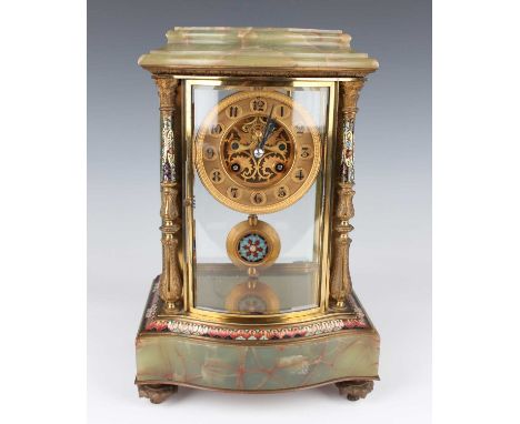 A late 19th century French brass, onyx and champlevé enamel four glass mantel clock with eight day movement striking hours an