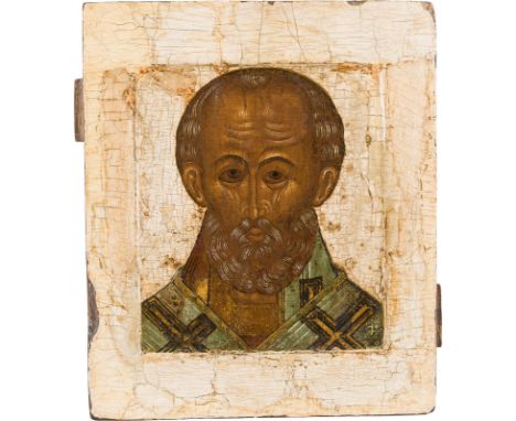 AN ICON SHOWING ST. NICHOLAS OF MYRA Russian, 17th century Tempera on wood panel with kovcheg. The background and border stri