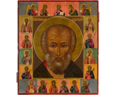 A LARGE ICON SHOWING ST. NICHOLAS OF MYRA, DEISIS AND SELECTED SAINTS Russian, 19th century Tempera on wood panel, the haloes