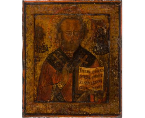 AN ICON SHOWING ST. NICHOLAS OF MYRA Russian, 18th century Tempera on wood panel with kovcheg. The background and border etch