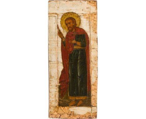 A FRAGMENT OF AN ICON SHOWING A SAINT Russian, 18th century Tempera on wood panel with kovcheg. The halo made of gold. The ba