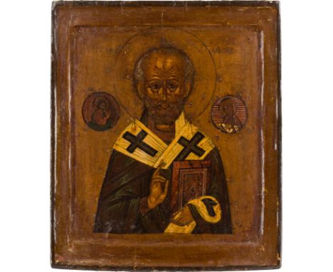 AN ICON SHOWING ST. NICHOLAS OF MYRA Russian, 17th century Tempera on wood panel with double kovcheg. Overpainted, restored. 