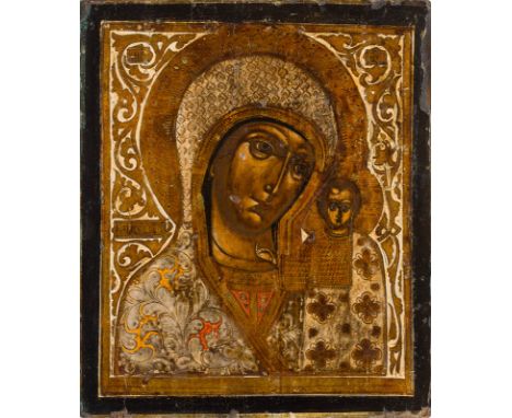 A LARGE ICON SHOWING THE KAZANSKAYA MOTHER OF GOD Russian, 19th century Tempera on wood panel. The garments made of silver, c