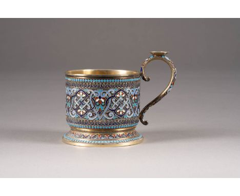 A SILVER-GILT AND CLOISONNÉ ENAMEL TEA GLASS HOLDER Russian, Moscow, Gustav Klingert, 1891 On spreading blue enamel dot friez