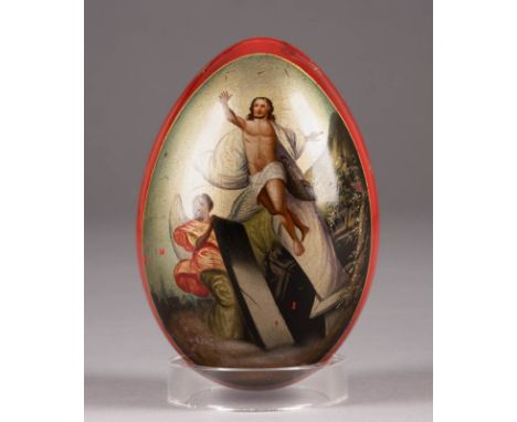 A RED LACQUERED PAPIER-MACHÉ EASTER EGG Russian, late 19th century Ovoid, the front centring an oval panel depicting an archi