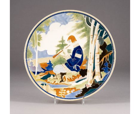 A LARGE FAIENCE PLATE SHOWING A BOY PLAYING THE FLUTE Soviet Union, Konakovo, Kalinin Faience Factory, circa 1930 Marked unde