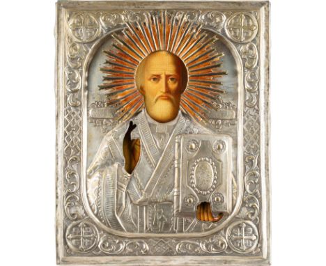 A LARGE ICON SHOWING ST. NICHOLAS OF MYRA WITH OKLAD Russian, mid 19th century Oil on wood panel. Overlaid with a chased and 