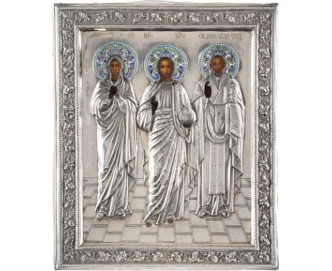 A RARE ICON SHOWING CHRIST FLANKED BY THE MOTHER OF GOD AND ST. NICHOLAS THE MIRACLE WORKER WITH A SILVER AND CLOISONNÉ ENAME