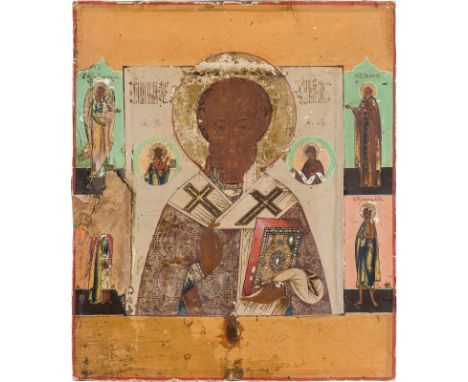 AN ICON SHOWING ST. NICHOLAS OF MYRA Russian, circa 1800 Tempera on wood panel with kovcheg. The haloes made of gold. Four se