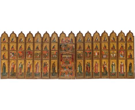 A RARE TRAVELLING FOLDING ICONOSTASIS Russian, 19th century Tempera on wood panels with kovcheg. Consisting of fifteen panels