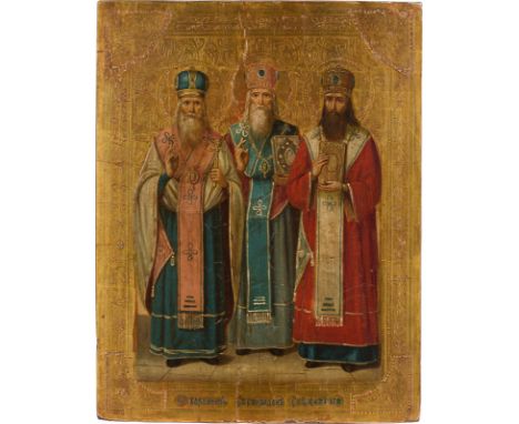 AN ICON SHOWING THREE HOLY BISHOPS: STS. HARALAMBOS, SPIRIDON AND BASIL THE GREAT Russian, circa 1875 Oil on wood panel. The 