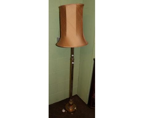 A brass standard lamp with reeded decoration 