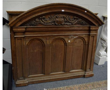 An oak fire surround with triple arch panelled superstructure Circa 1900. Overall condition is generally good though the poli