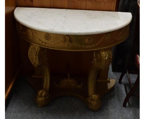 A reproduction marble topped demi-lune console table with gilt base