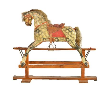 A painted wood and composition rocking horse, first half 20th century, dappled grey, with horsehair mane and tail and corded 