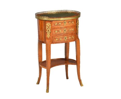 ϒA Louis XVI kingwood, parquetry, and gilt metal mounted petite commode, circa 1770, of oval form, with three drawers and a s