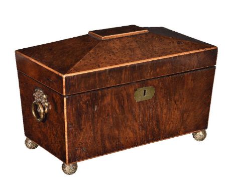 A George IV burr walnut and sycamore strung tea caddy, circa 1825, of sarcophagus form, mounted with floral cast gilt metal r