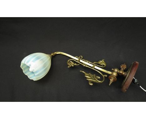 A Victorian brass gas wall light with Vaseline glass shade 