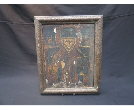 An 18th Century Russian Icon hand-painted on wood panel with religious figure and lettering. Wormed in places, 39cm x 30cm