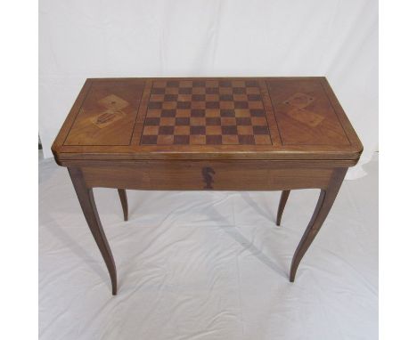 A 19th Century French walnut and marquetry card table decorated with inlaid chess pieces, playing cards, dominoes and dice de