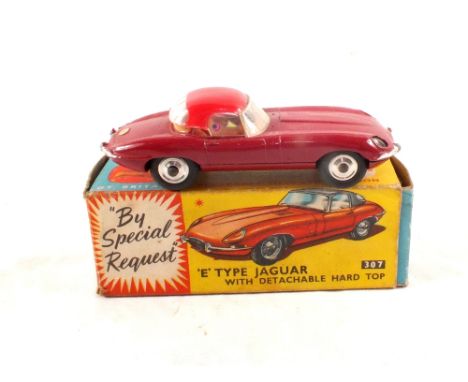 A boxed Corgi 307 Jaguar E Type, plum body