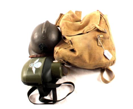 A French helmet with a haversack (dated 1944) and its contents