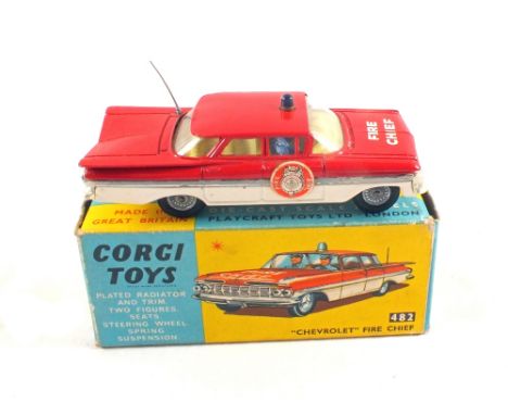 A boxed Corgi Toys 482 'Chevrolet' fire chief car, with decals on bonnet and doors with two persons