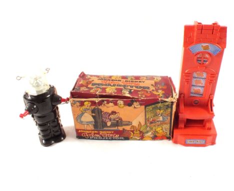 A boxed Johnson Disney film projector and films, a money box plus a small tin plate robot