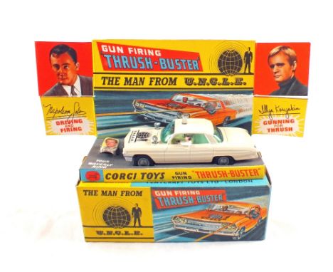 A boxed Corgi Toys 497 The Man from Uncle Gun Firing 'Thrush-Buster', in white with ring, comes with original packaging paper