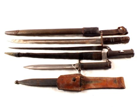 Three bayonets, a US P17, Swedish model 1896 and an 18th Century Brown Bess, all with scabbards