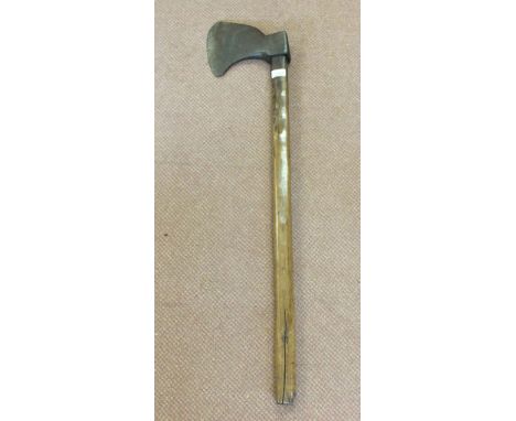A vintage iron axe on wooden shaft