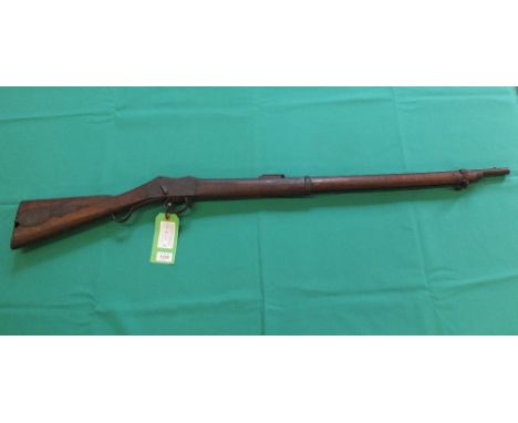 A Martini Henry .577/450 rifle, lock marked Z.A.R. 6972, 'patch box' added to R/H/S of butt, this lot was a genuine 'loft fin