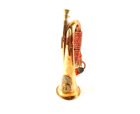 A military copper and brass bugle with Royal Welsh Fusiliers badge