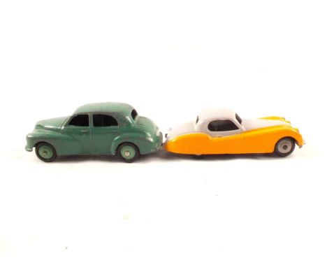 A Dinky 1950-54 40G Morris Oxford with dark green body and light green hubs plus 157 1957-9 Jaguar XK120 with yellow and grey