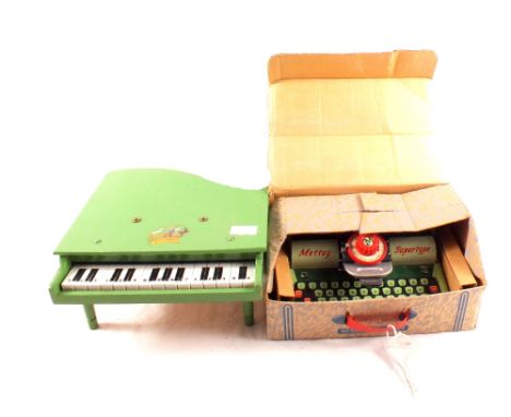 A boxed Mettoy tin plate typewriter with instructions and spare ribbon plus a Pixiano toy piano