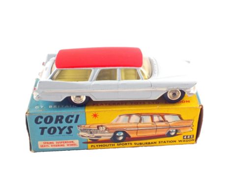 A boxed Corgi Toys 445 Plymouth Sports Suburban station wagon with pale blue body, red roof and yellow interior