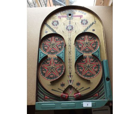A Lindstrom tin plate super gold star bagatelle board