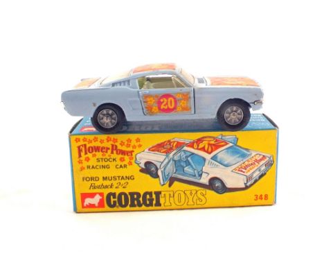 A boxed Corgi Toys 348 Ford Mustang stock racing car fastback 2+2 flower power, in pale blue, No.20 decal and floral decals