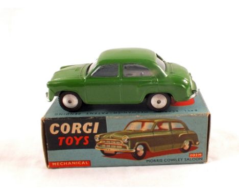 A boxed Corgi Toys 202M mechanical Morris Cowley saloon, in dark green