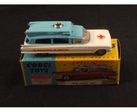 A boxed Corgi Toys 437 Superior Ambulance on Cadillac chassis, in white and pale blue