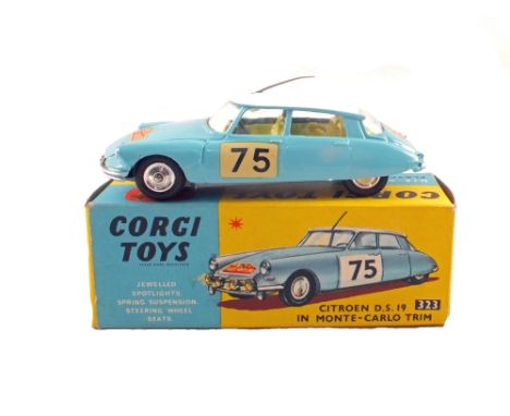 A boxed Corgi Toys 323 Citroen D.S.19 in Monte-Carlo trim with light blue body, white roof, No.75 decal and yellow interior