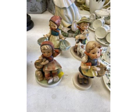 Four Hummel figures
