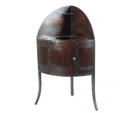 A Victorian mahogany corner washstand fitted with a single panel door above a single drawer on splayed square taper legs, 68c