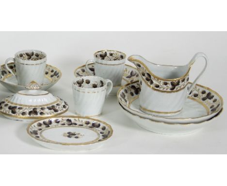 A Worcester part tea service, circa 1810, comprising two bread and butter plates, three coffee cans and two saucers, a cream 