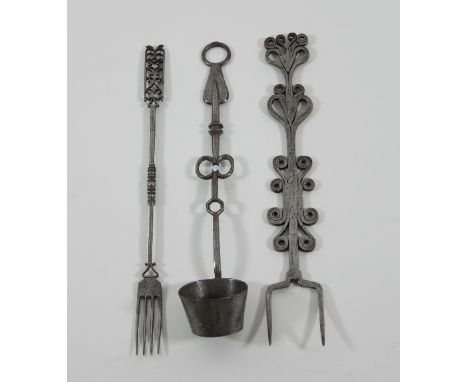 A late 17th Century wrought iron flesh or toasting fork, worked with decorative scrolls, 44cm long, an 18th Century ladle and