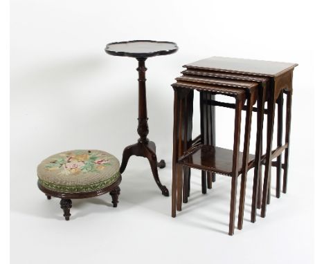 A nest of four mahogany tables, a footstool and a tripod table